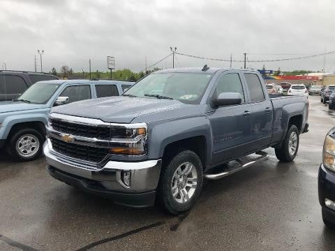 Chevrolet Silverado parked in a lot on rainy day